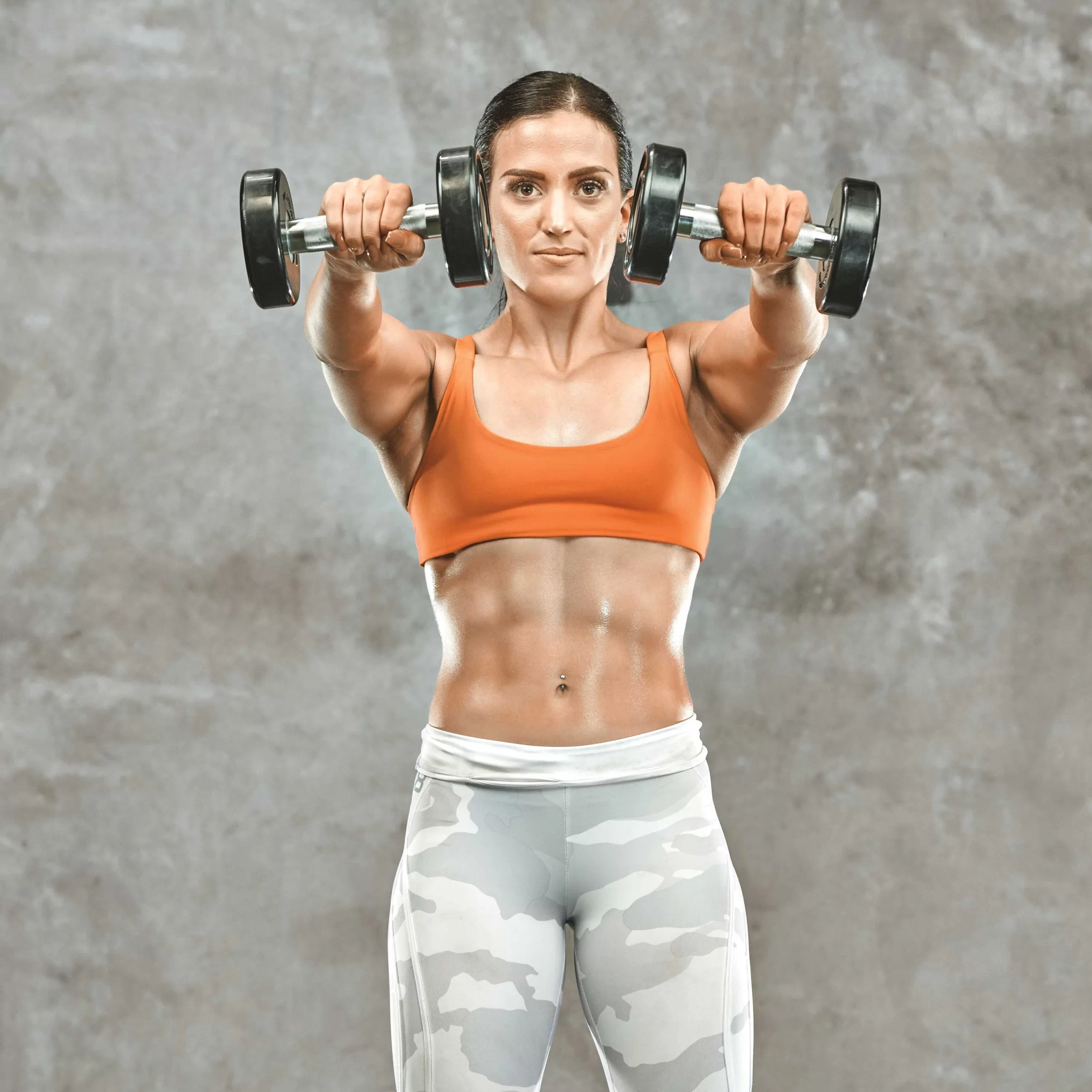 Raise Your Game With the Dumbbell Front Raise - Train Fitness Blog